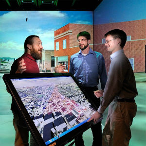 Peter Sforza (center) previously worked on a 3-D Blacksburg modeling project with Nicholas Polys, director of visual computing with the Virginia Tech Research Computing Group (left), and Thomas Dickerson, a former Virginia Tech research associate.