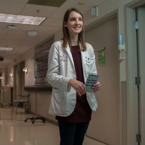 Third-year Virginia Tech Carilion School of Medicine student Alyssa Savelli at Carilion Roanoke Memorial Hospital. She recently began her surgery clerkship. Savelli is a recipient of the McCall Scholarship.