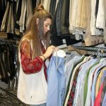 Blythe Boyd sorts through donated clothes.