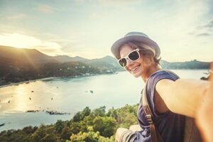 young woman traveler in sunglasses