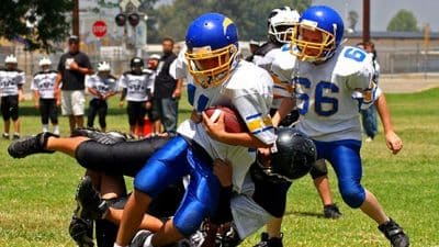 youth sport football tackle