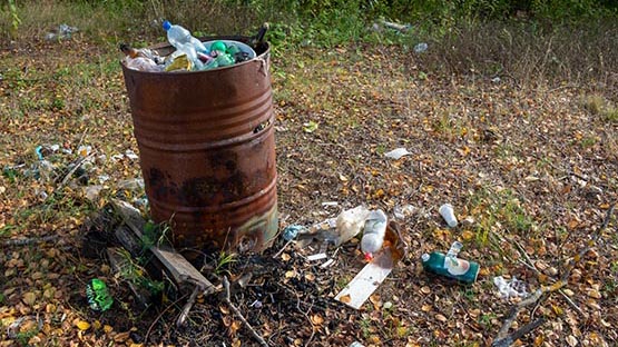 trash in barrel for burning