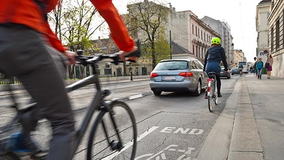 bicycle cyclist helmet bicyclist bike lane traffic city