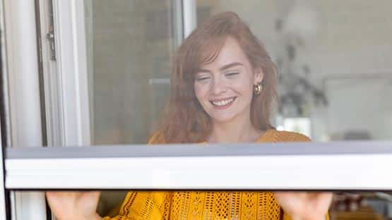 woman opening office window