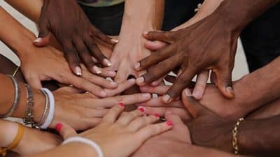 group of hands showing diverse population