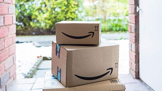 Amazon boxes on door step of home