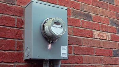 electric smart meter on brick