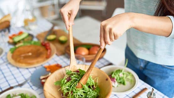 family preparing salad