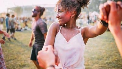 Black woman dancing at festival