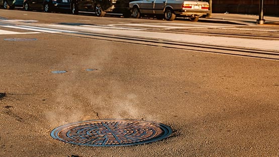 smoke rising from manhole