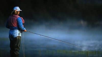 woman fly fishing
