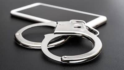 phone handcuffs arrest photograph camera spying