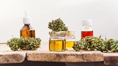 Green Kush in clear glass jar THC flower cannibis