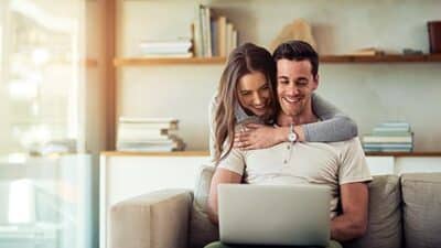 couple laptop happy computer home