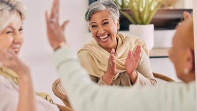 happy senior women retirement celebration laughing