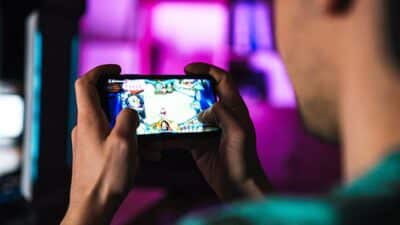 man gaming on phone
