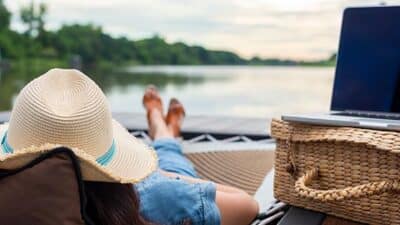 work from stay self catering woman resting by lake