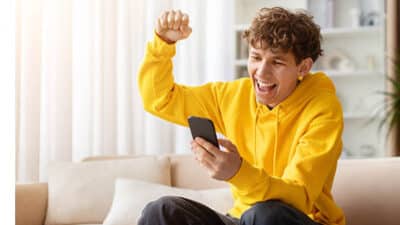 young man happy phone