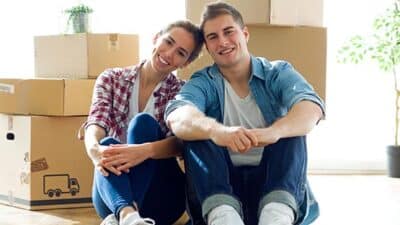 moving packing boxes couple family home